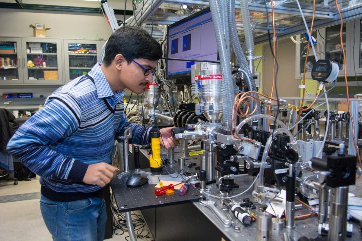 Physics student works in lab