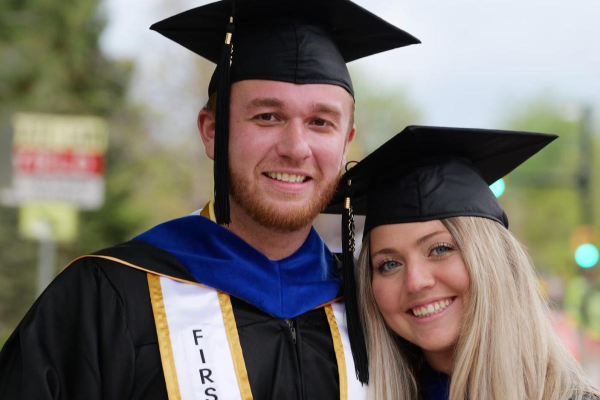 Students posing after graduation