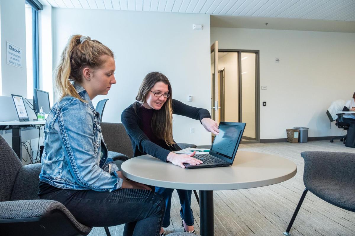 Student meeting with admissions counselor