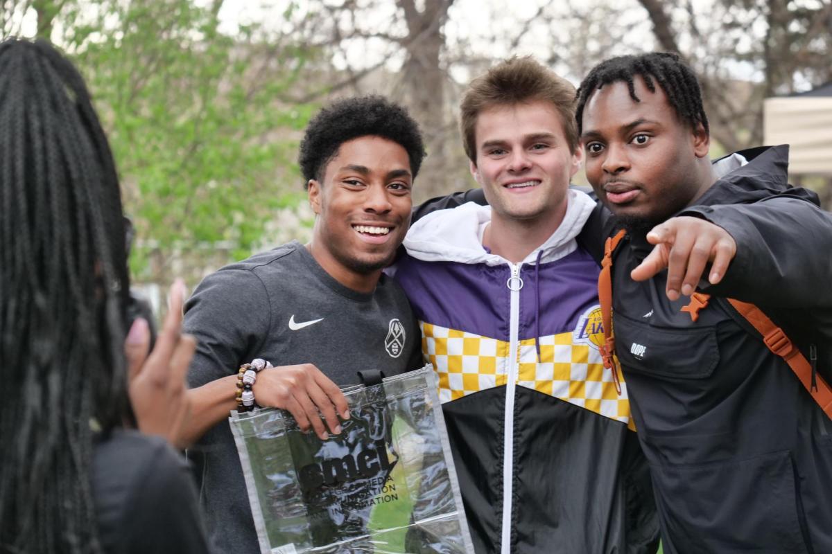 Students posing for the camera during Grad Bash