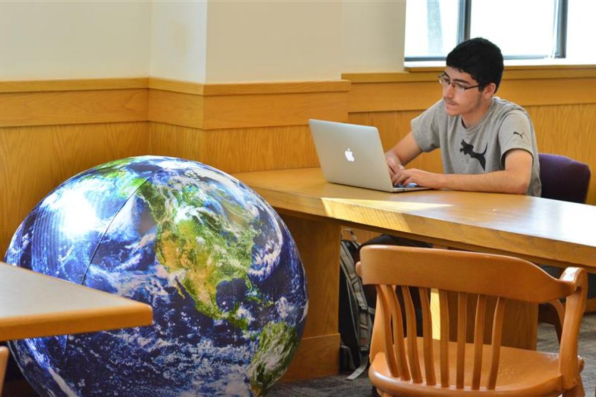 Student on laptop in classroom