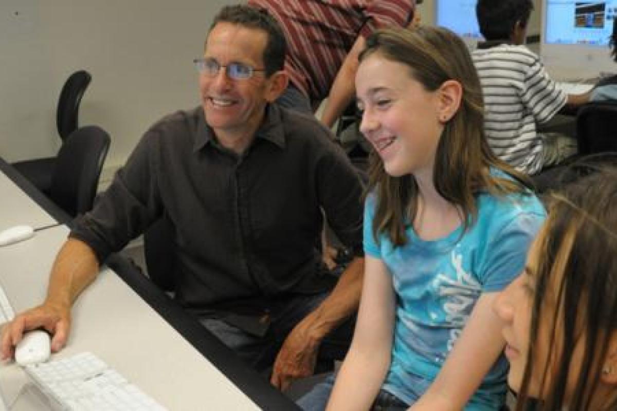 Teacher working with young students