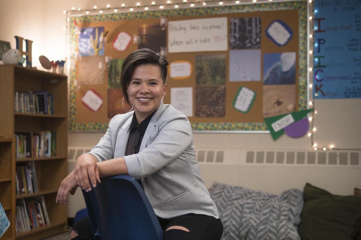 Teacher sitting in classroom