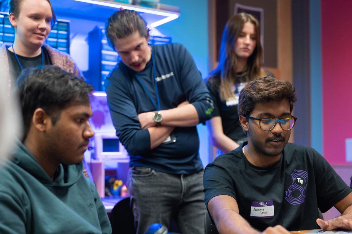 Creative technology and design students looking at a screen