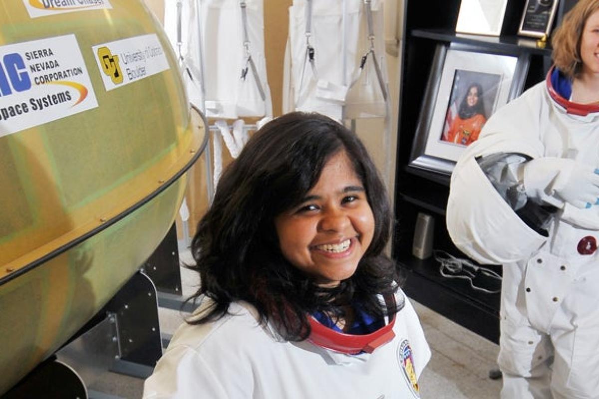 Two aerospace engineer students in astronaut suits