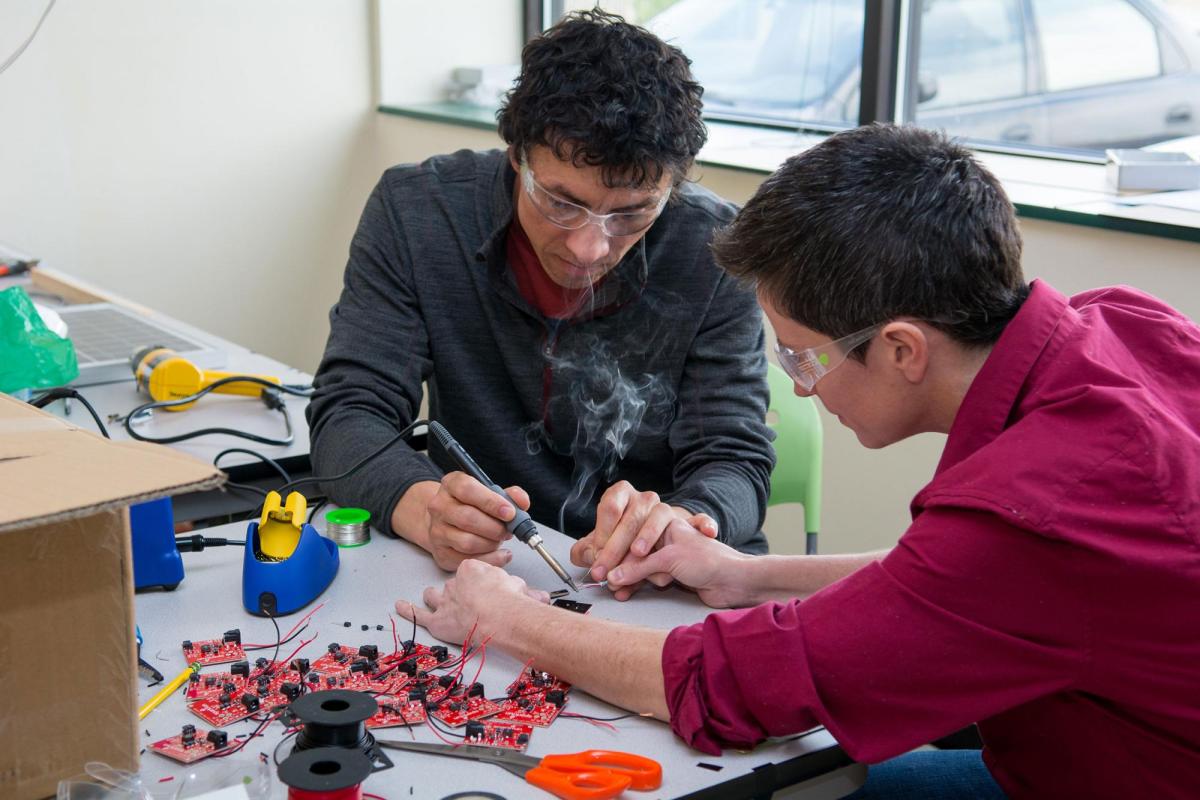 Two students working on engineering project