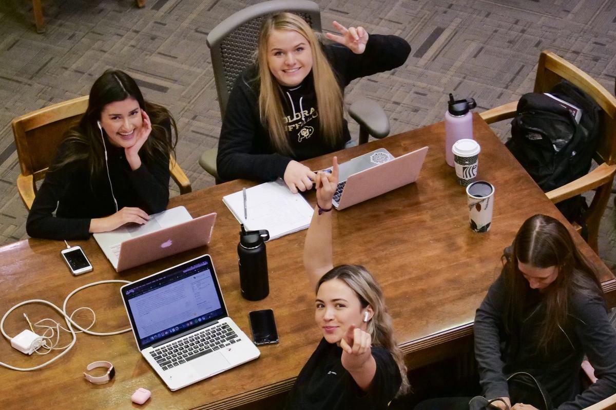 Students studying in Norlin Library