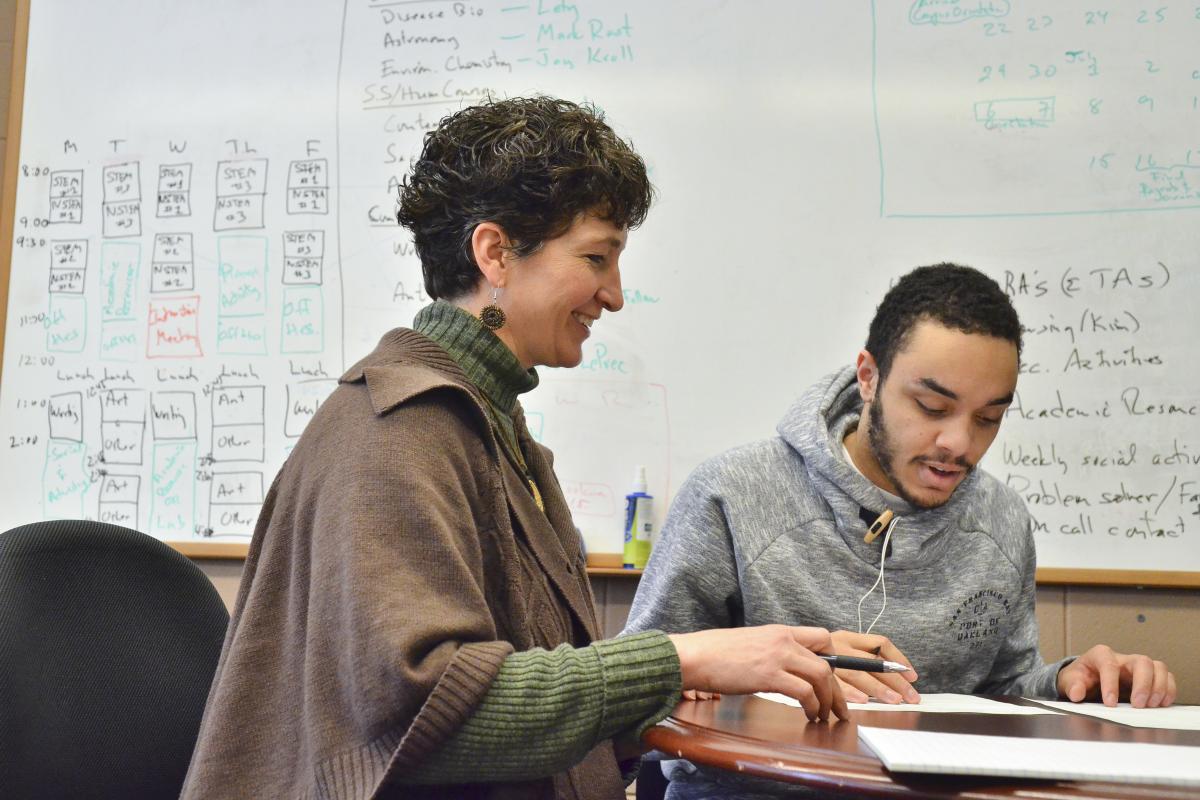 Karen Ramirez working with a student