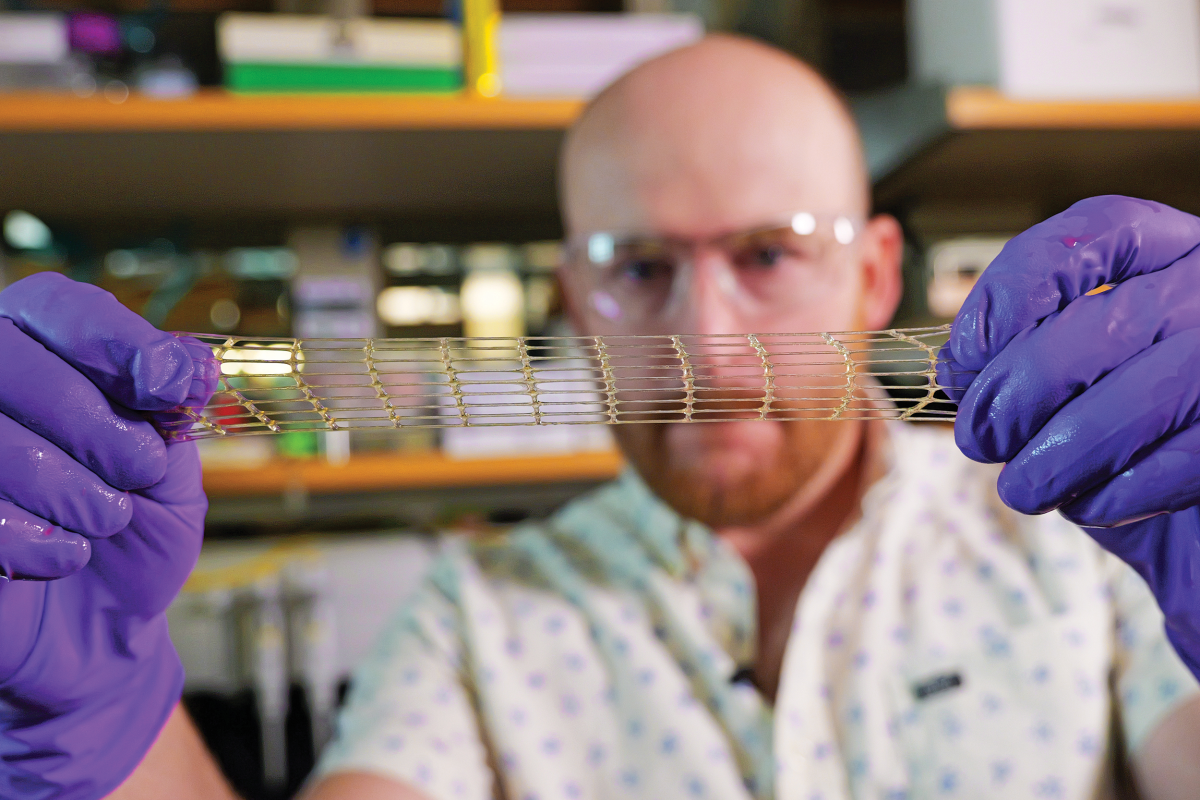 Matt Davidson, a research associate in the Burdick Lab, shows off a 3D-printed material that could be used for a variety of medical applications