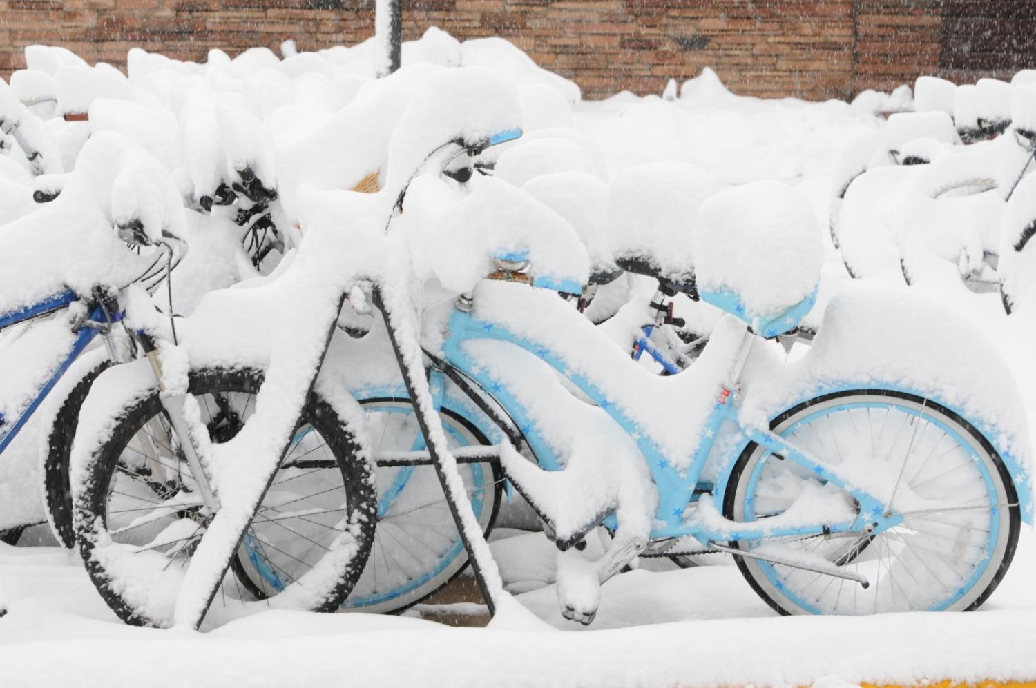 Bicycles covered in snow