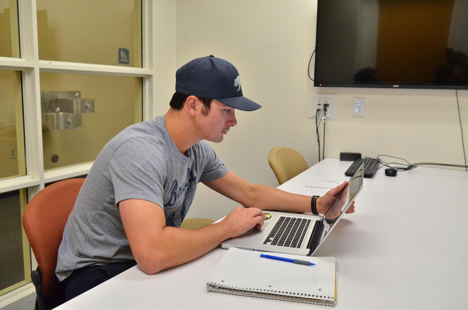 Student on laptop in Business Library