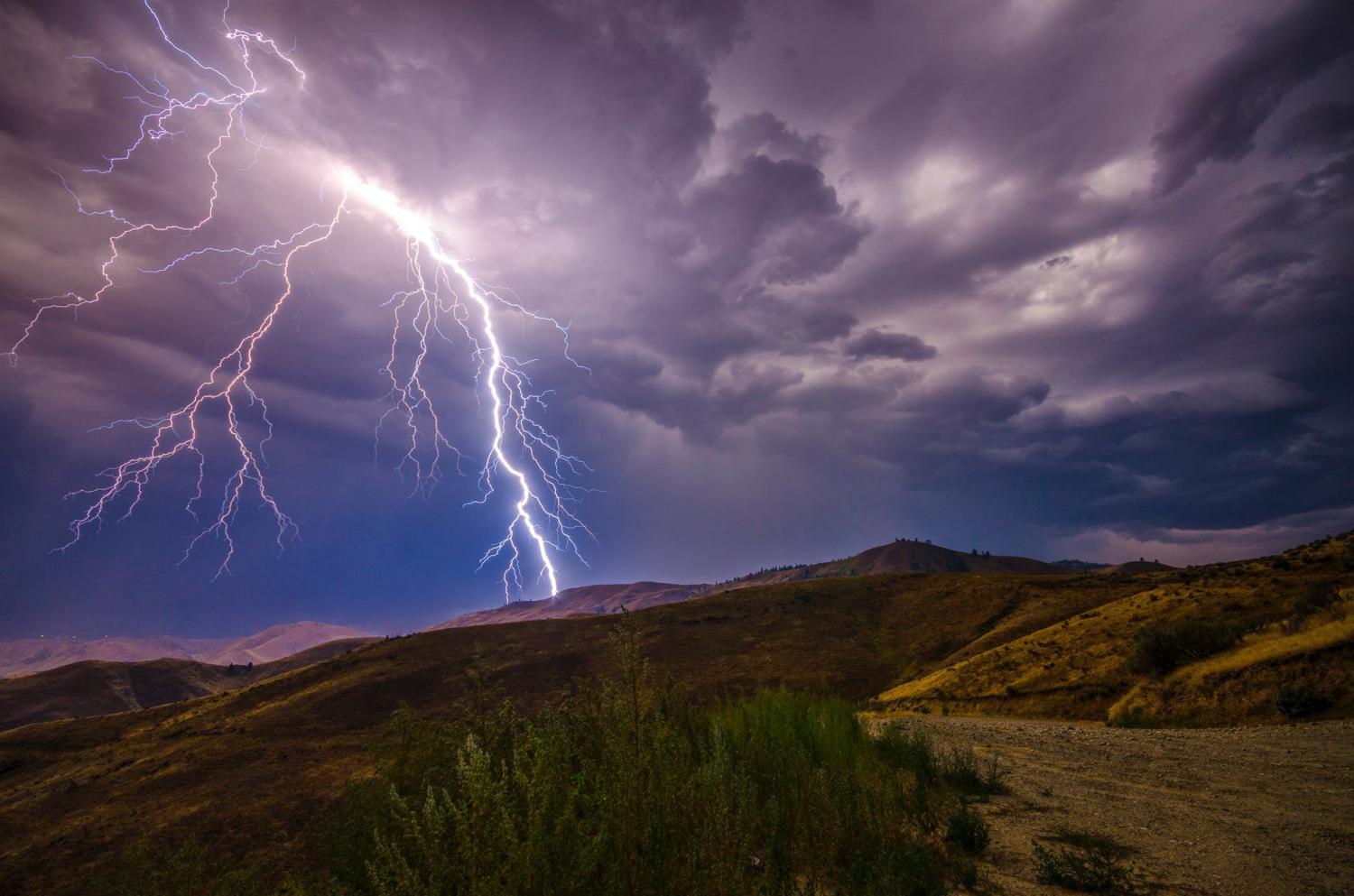 Thunderstorm above hillside