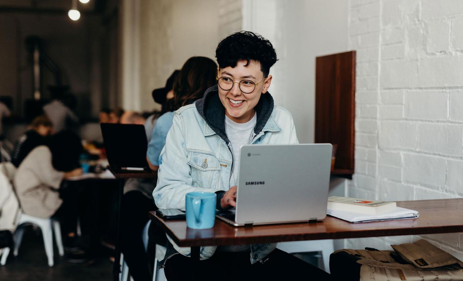 Student on laptop in cafe