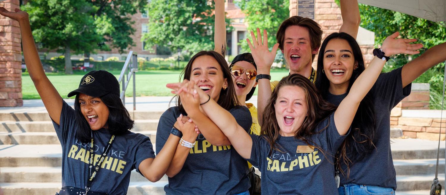 Students wearing CU Buffs gear celebrating at move-in table