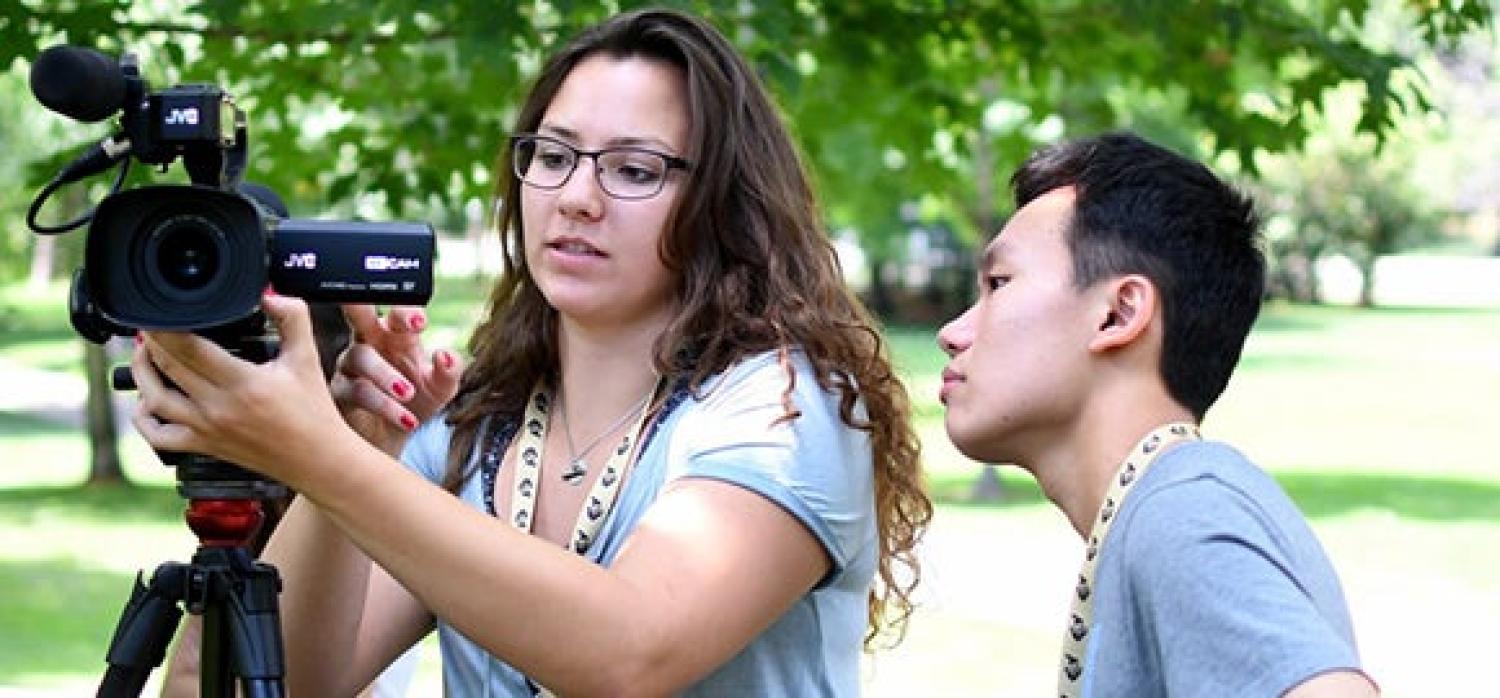 Students working with a video camera for class