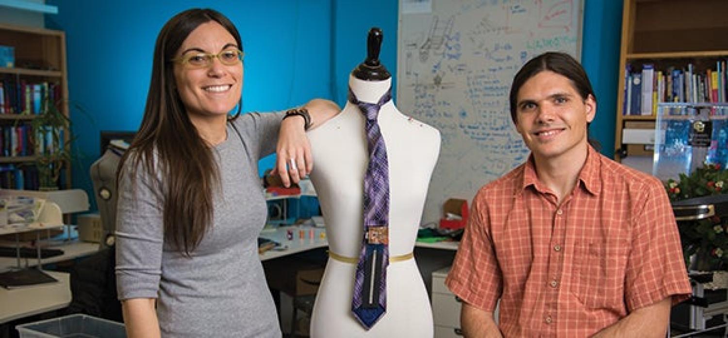 Students standing in front of wearable technology on a tie