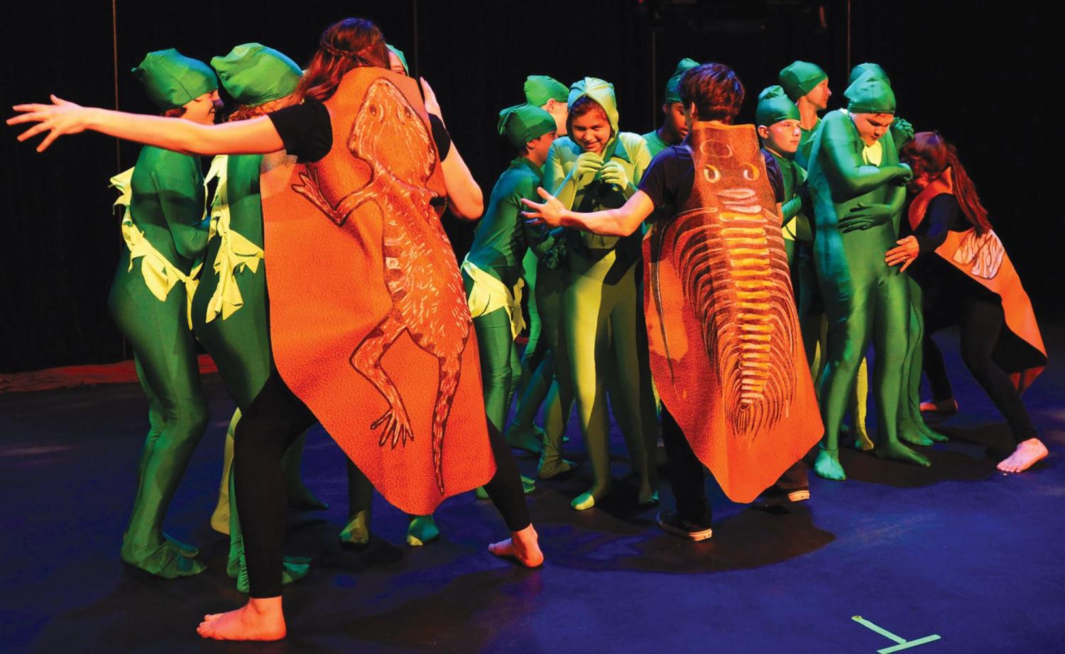 Kids in costume acting out a performance about the climate