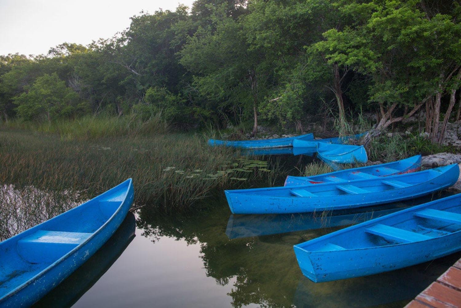 Laguna with blue canoes