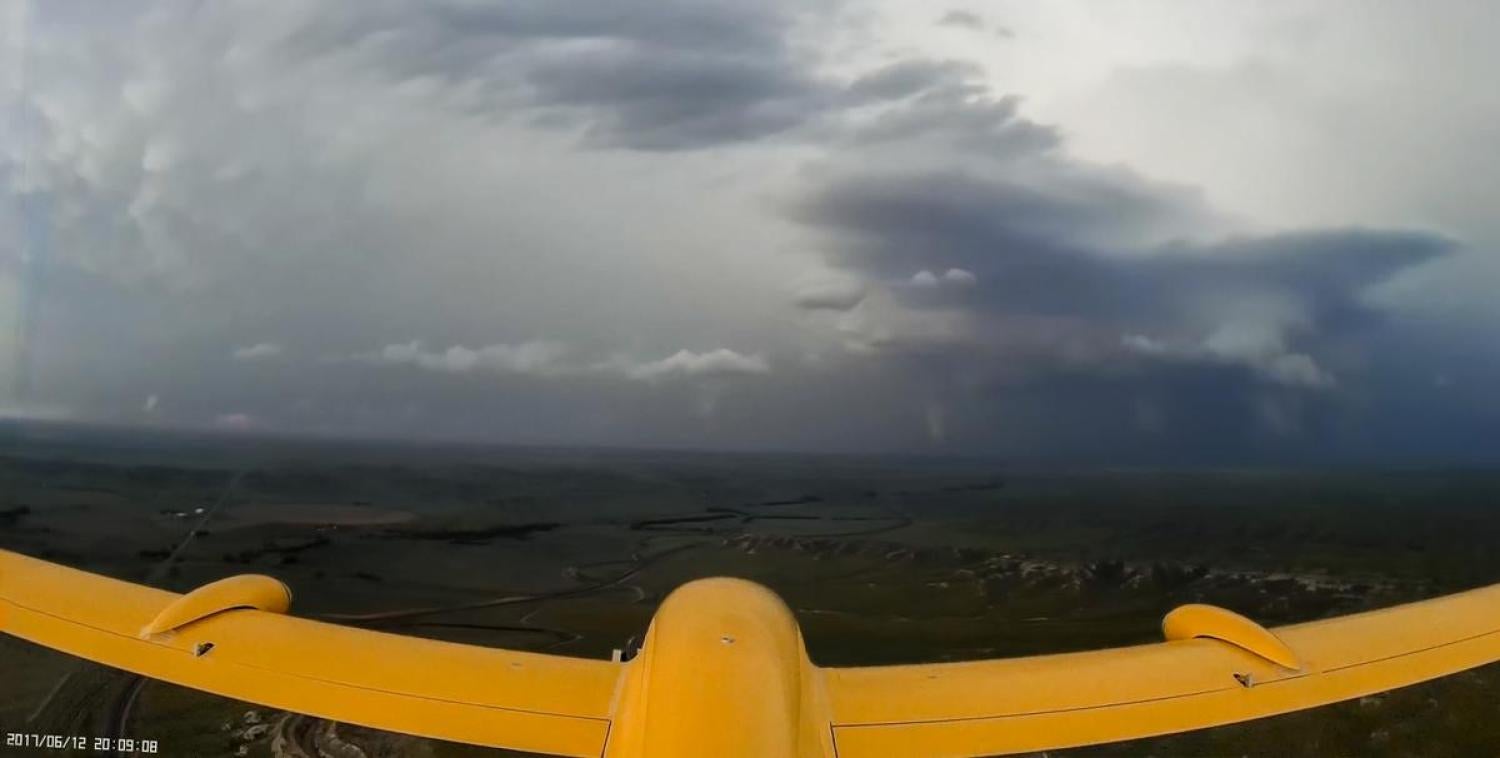 Project STORM team flies the IRISS TTwistor UAS toward a supercell with a tornado on the ground.