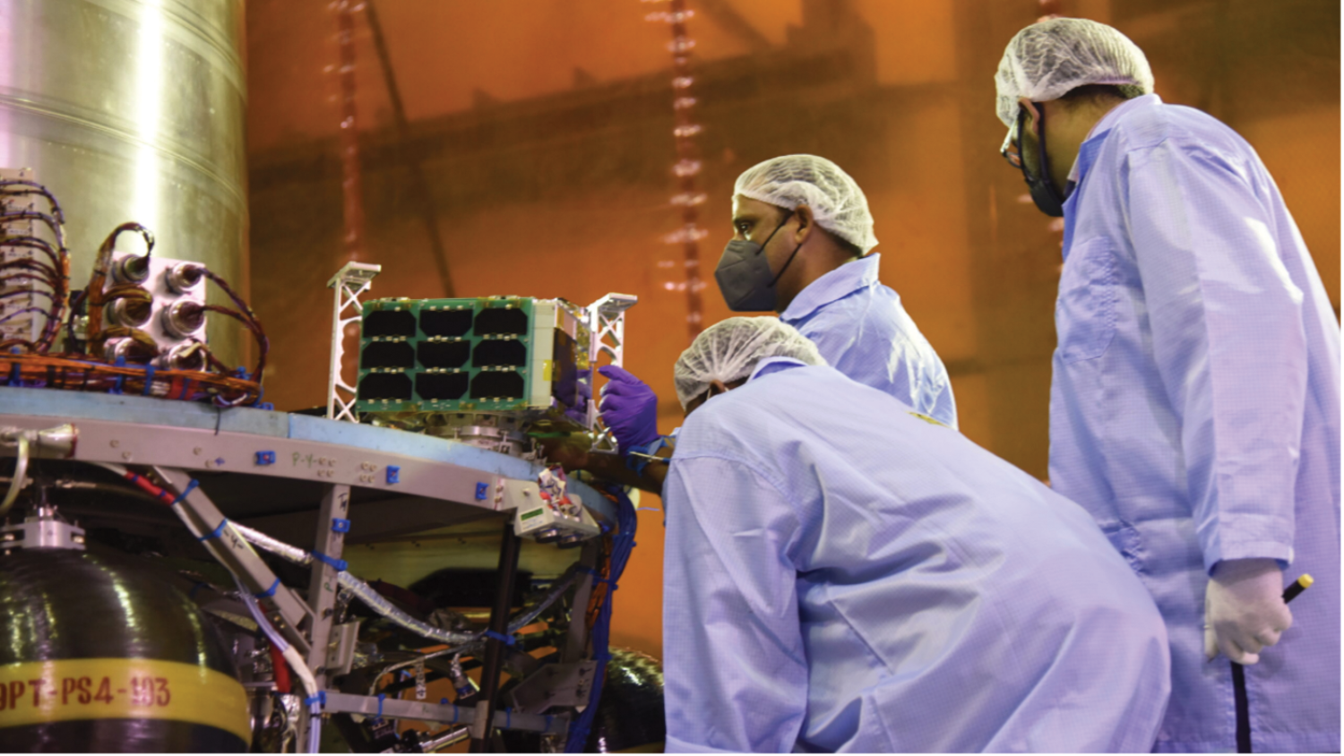 LASP researchers in a clean room facility