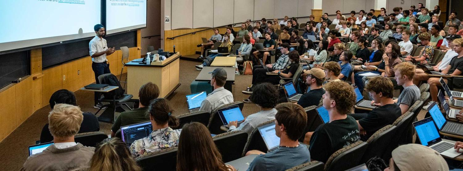 Students in a CU Boulder classroom, listening to a lecture by an instructor.