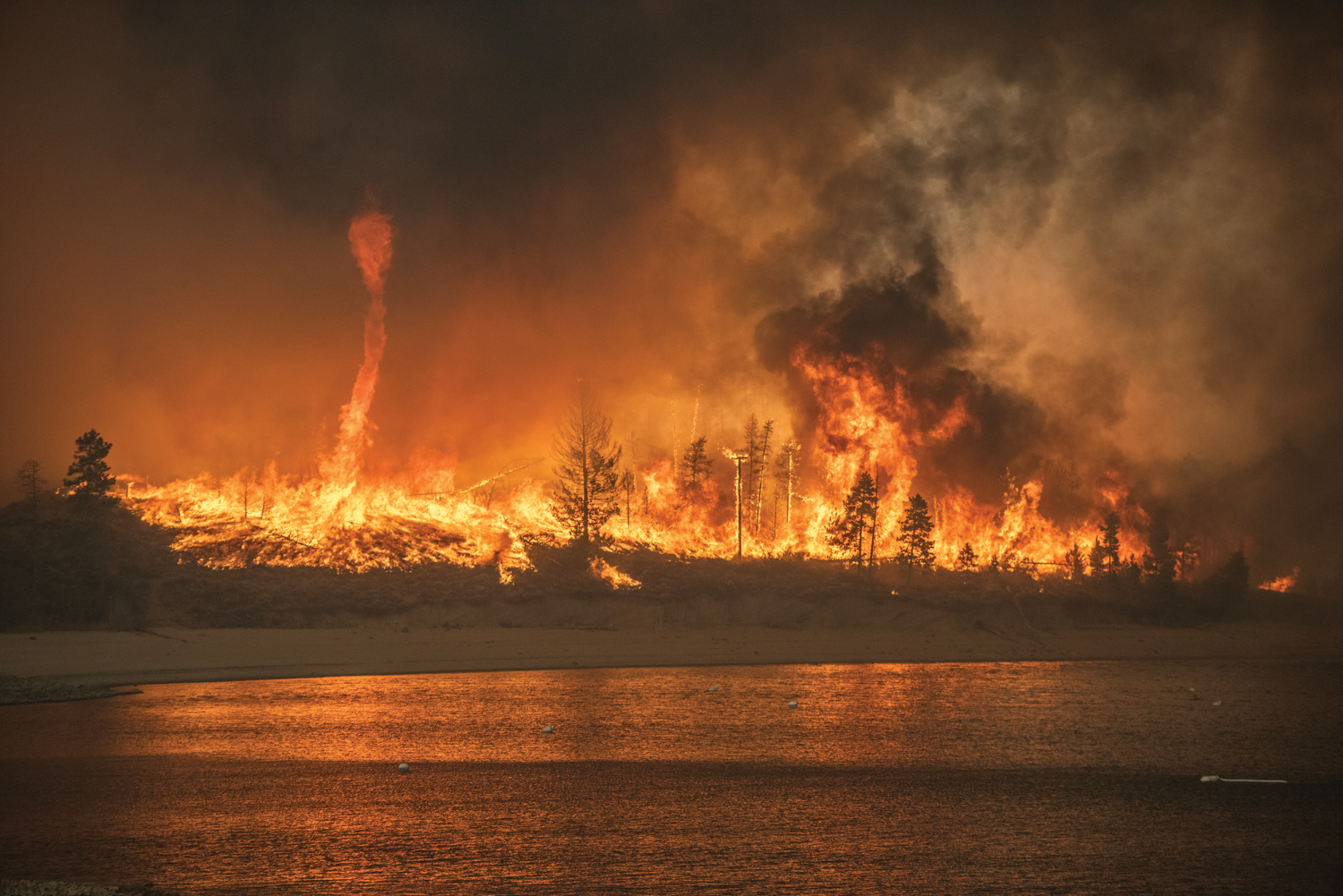 A fire whirl forms during the fast-moving East Troublesome Fire in 2020