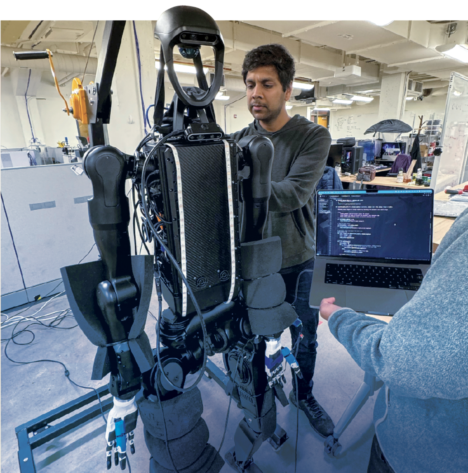 Nikolaus Correll works on CU's first humanoid robot in the lab