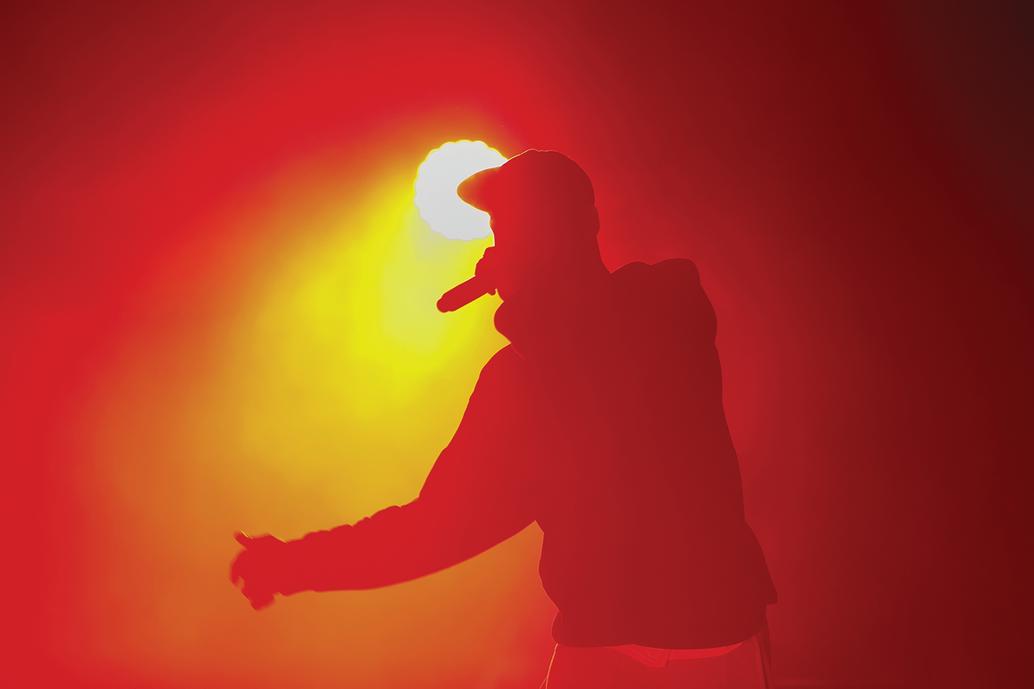 Hip-hop performer silhouetted against stage light (Photo: Gennadiy Kravchenko/istockphoto.com))