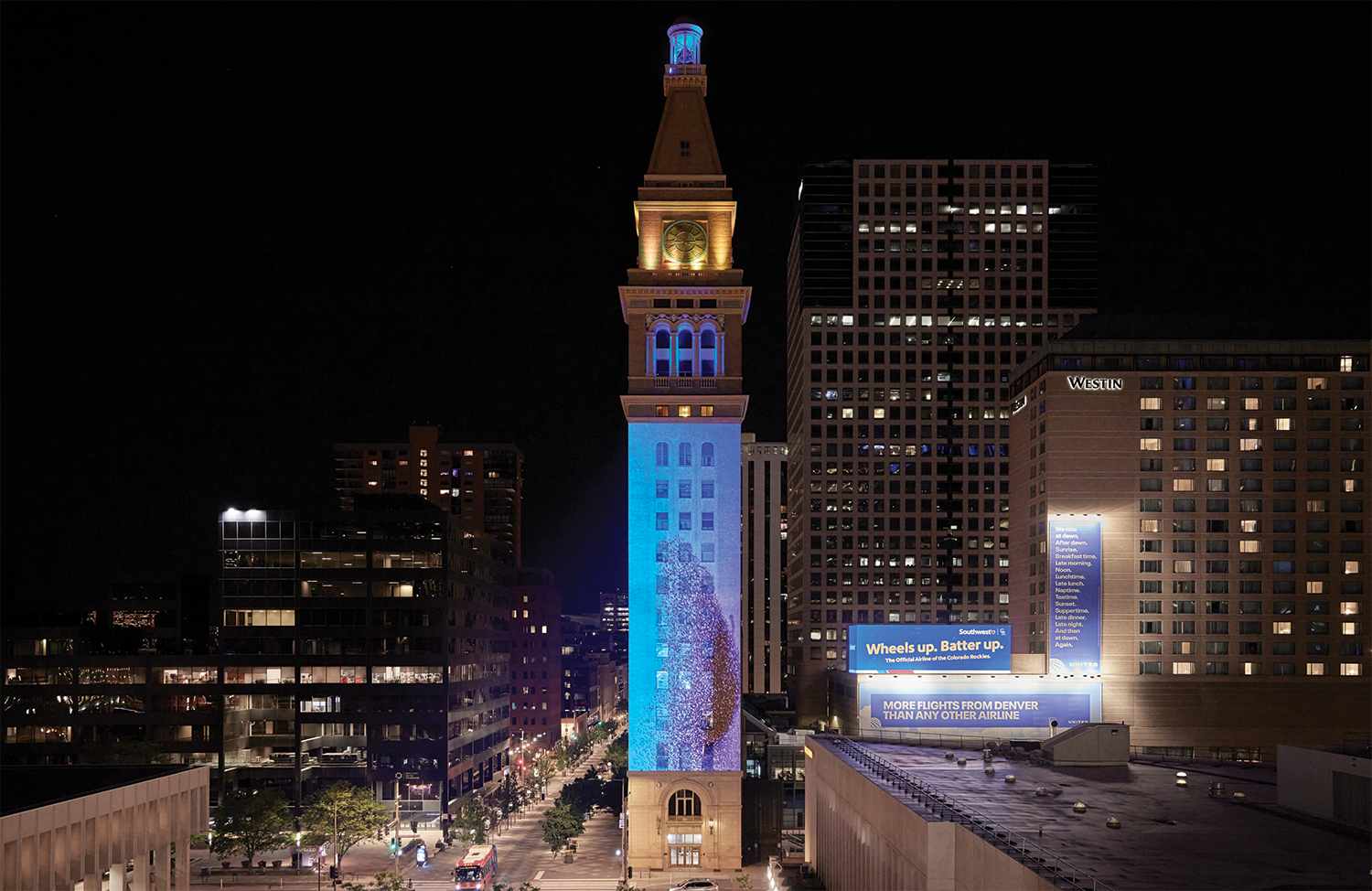 Molly Valentine Dierks' immMolly Valentine Dierks’ immersive video installation “The Tender Hand of the Unseen” shown on D&F Tower in Denver 