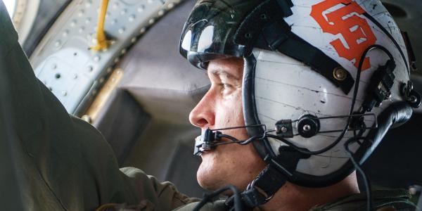 Navy Petty Ofﬁcer 2nd Class Joshua Soderstrom ﬂies an MH-60S Seahawk helicopter.