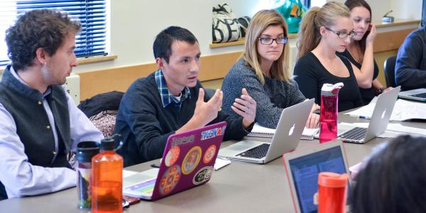 Students with laptops in Religious Studies class