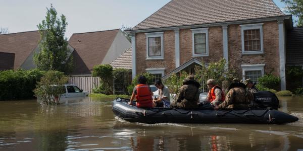 U.S. Marine Corps escorting the community on raft