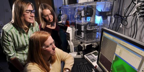 Professor and students in lab