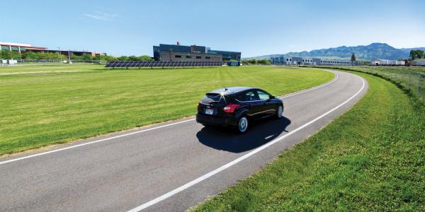 Electric car driving in Boulder, CO