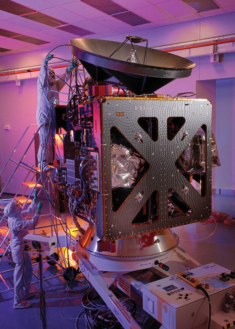 Engineers at CU Boulder’s Laboratory for Atmospheric and Space Physics (LASP) perform inspections of the Hope Probe spacecraft.
