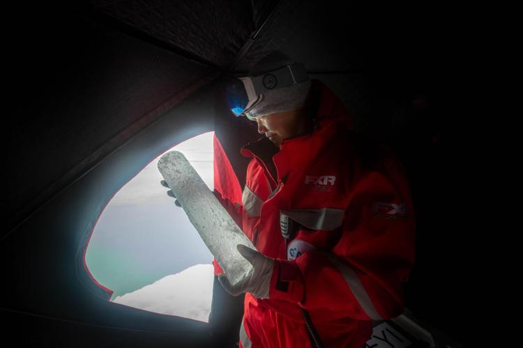 Scientist holding ice core