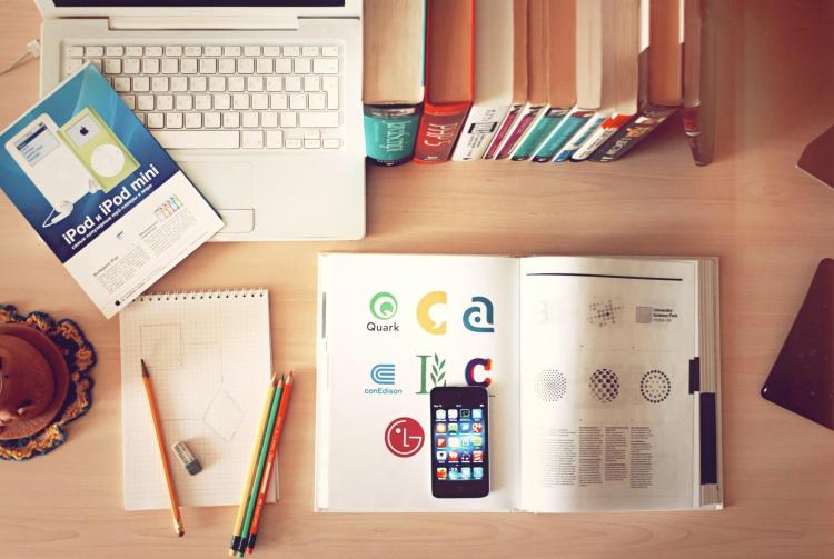Laptop and books on desk