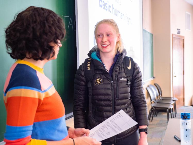 CU Boulder professor helping a student