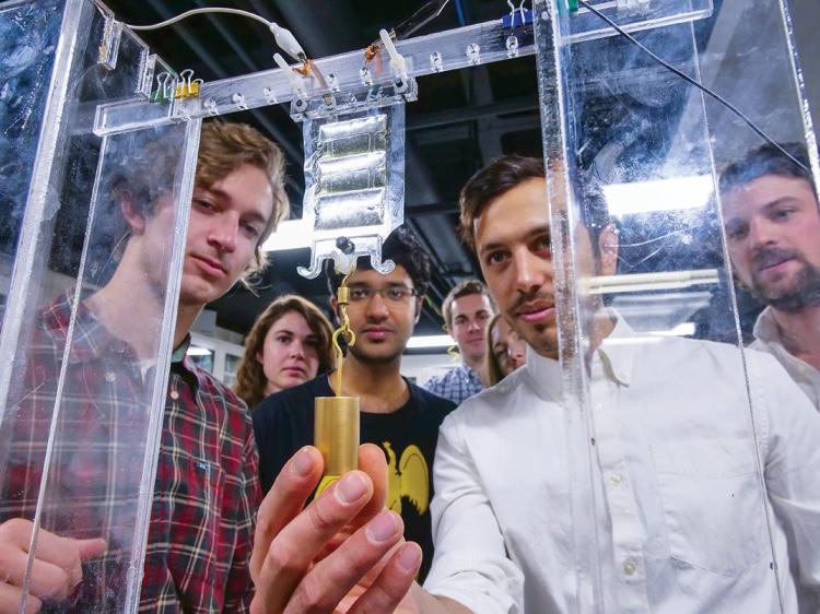Research team testing soft, flexible device