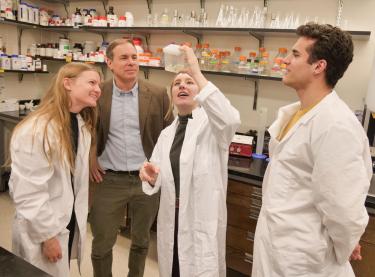 Brian DeDecker with students in his lab.