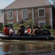 U.S. Marine Corps escorting the community on raft
