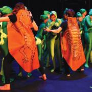 Kids in costume acting out a performance about the climate