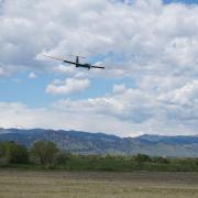 Drone flying in the foreground with the Foothills in the background