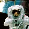 NASA astronaut services the Hubble Space Telescope from orbit in 1997