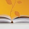 Open book and plant graphic