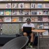 Student working on laptop in library