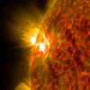 An active region on the sun emits a solar flare—a powerful burst of radiation