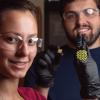 Researchers holding shape shifting material