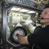 NASA astronaut Terry Virts manipulating a BioServe experiment on ISS. 
