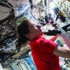 Astronaut Christina Koch (above) uses a microscope supplied by BioServe aboard the International Space Station. 